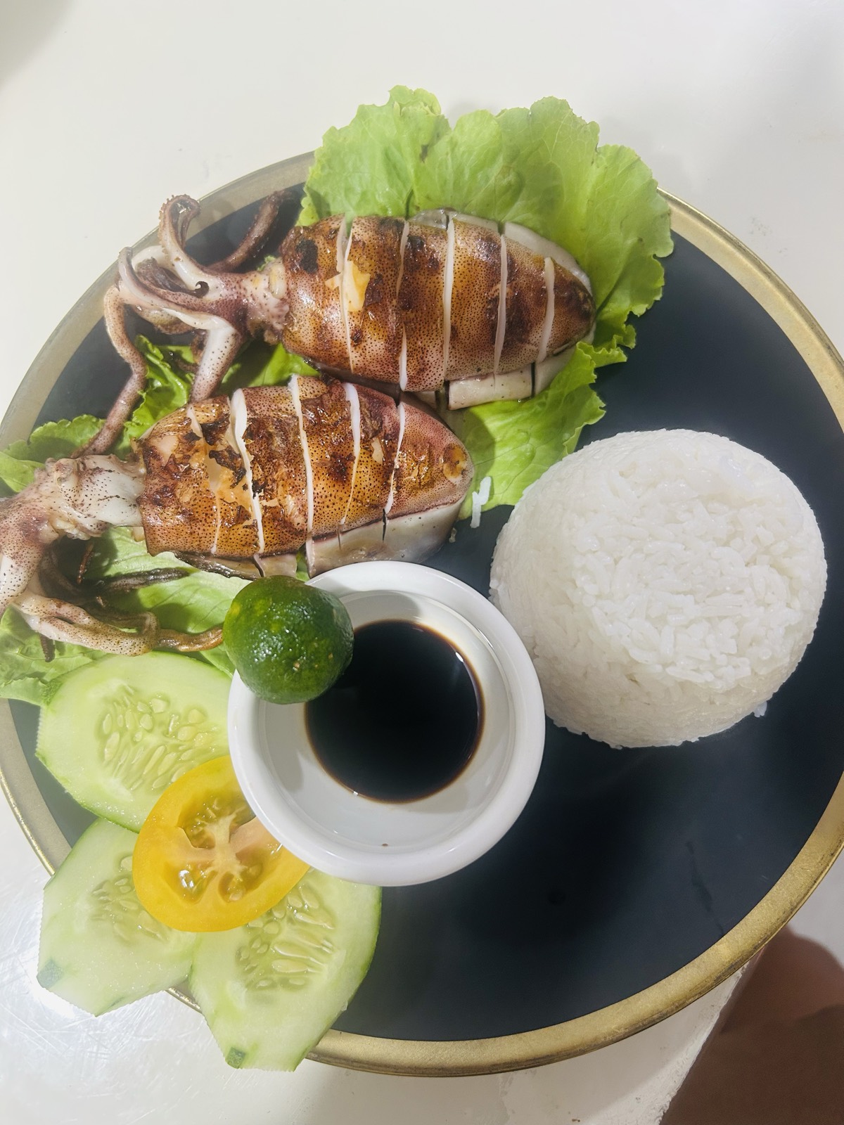 Grilled stuffed squid with rice and calamansi at Mai Tai Port Barton