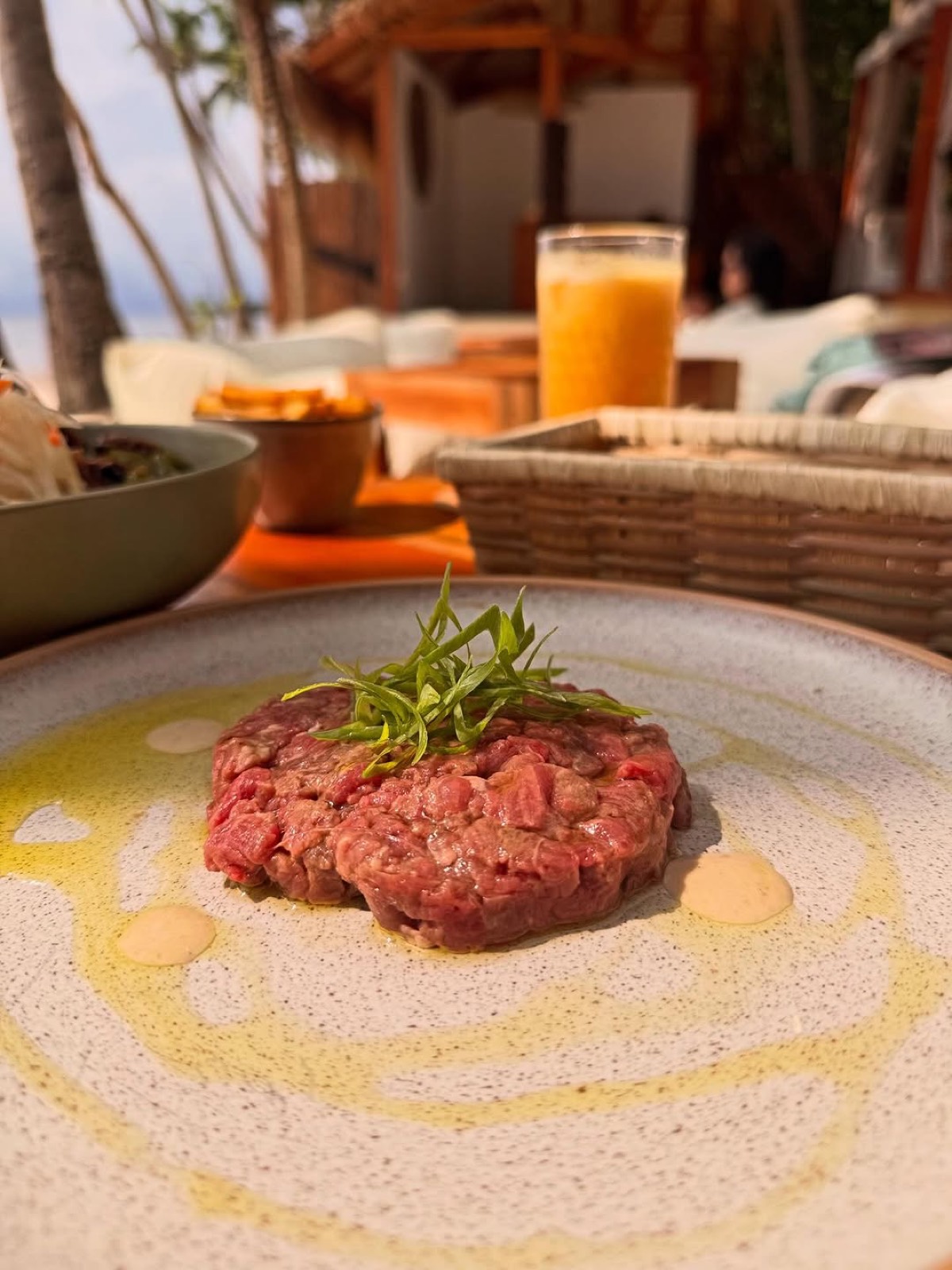 Beef tartare plated against the beachfront at Mai Tai Siquijor